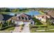 Aerial view of house, lake and other homes in the neighborhood at 4354 Barletta Ct, Wesley Chapel, FL 33543