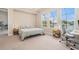 Comfortable bedroom featuring large windows, and neutral decor at 4354 Barletta Ct, Wesley Chapel, FL 33543
