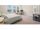 Bright bedroom with a work space and view of the water at 4354 Barletta Ct, Wesley Chapel, FL 33543