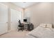 Cozy bedroom with a workspace, neutral colors, and ample closet space at 4354 Barletta Ct, Wesley Chapel, FL 33543