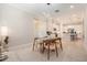 Cozy dining room leading to the kitchen with bright light and modern design at 4354 Barletta Ct, Wesley Chapel, FL 33543