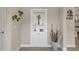 Hallway nook displaying built in shelving, a plant, and decorations at 4354 Barletta Ct, Wesley Chapel, FL 33543
