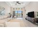 Living room featuring neutral sofa, large window views, and stylish décor at 4354 Barletta Ct, Wesley Chapel, FL 33543