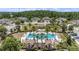 Relax in this community pool with a fountain, surrounded by palm trees and attractive cabana at 4354 Barletta Ct, Wesley Chapel, FL 33543