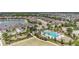 Enjoy this community pool with well manicured landscaping, ample seating and a neighborhood lake nearby at 4354 Barletta Ct, Wesley Chapel, FL 33543