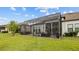 Relax on this screened patio with outdoor furniture and enjoy the views at 4354 Barletta Ct, Wesley Chapel, FL 33543