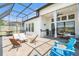 Large screened-in patio with seating, outdoor kitchen and dining area at 4354 Barletta Ct, Wesley Chapel, FL 33543