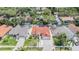 Aerial view of a neighborhood showcasing lush landscaping and backyard pools at 4847 Harbor Woods Dr, Palm Harbor, FL 34683