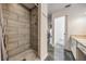 Modern bathroom featuring a stylish tiled shower and updated vanity at 4847 Harbor Woods Dr, Palm Harbor, FL 34683