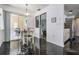 Charming breakfast nook adjacent to kitchen with seamless access to the outdoors at 4847 Harbor Woods Dr, Palm Harbor, FL 34683