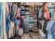 Walk-in closet with ample storage for clothes, shoes and accessories at 4847 Harbor Woods Dr, Palm Harbor, FL 34683