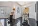 Open dining area with sliding glass doors to the patio and black marble-style flooring at 4847 Harbor Woods Dr, Palm Harbor, FL 34683