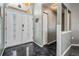Welcoming entryway with high ceilings, a decorative door with sidelights, and gray walls and shiny epoxy floors at 4847 Harbor Woods Dr, Palm Harbor, FL 34683