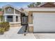 Close up of the home's front entrance with a well maintained lawn and colorful rock landscaping at 4847 Harbor Woods Dr, Palm Harbor, FL 34683