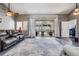 Spacious living room featuring a sliding glass door that offers a view of the pool area at 4847 Harbor Woods Dr, Palm Harbor, FL 34683