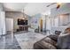 Spacious living room featuring high ceilings, modern epoxy floors, neutral walls, and comfortable furnishings at 4847 Harbor Woods Dr, Palm Harbor, FL 34683