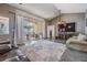 Bright living room with large sliding glass doors to lanai and neutral color palette at 4847 Harbor Woods Dr, Palm Harbor, FL 34683