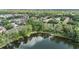 Aerial view of community nestled among trees, with a pond and private dock at 4917 Puritan Cir # 105, Tampa, FL 33617