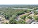 Aerial view of the property showcasing lush greenery, surrounding trees and serene lake nearby at 4917 Puritan Cir # 105, Tampa, FL 33617