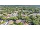 Aerial view of a community featuring mature trees, green landscaping, and neighborhood homes at 4917 Puritan Cir # 105, Tampa, FL 33617