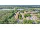 Aerial view of community showcasing lush greenery and nearby lake at 4917 Puritan Cir # 105, Tampa, FL 33617