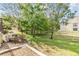 A tranquil backyard with lush greenery and mature trees, creating a peaceful retreat at 4917 Puritan Cir # 105, Tampa, FL 33617