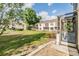 Spacious backyard featuring a well-maintained lawn and lush landscaping with views of the home at 4917 Puritan Cir # 105, Tampa, FL 33617