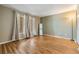 Spacious bedroom with hardwood flooring, natural light, and floor-to-ceiling windows at 4917 Puritan Cir # 105, Tampa, FL 33617