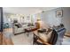 Comfortable living room featuring stylish furniture, neutral colors, and an open floor plan at 4917 Puritan Cir # 105, Tampa, FL 33617