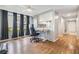 Bright office space featuring a workspace with natural light and hardwood flooring at 4917 Puritan Cir # 105, Tampa, FL 33617