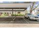 Assigned covered parking spot with car parked, close to the apartment at 4917 Puritan Cir # 105, Tampa, FL 33617
