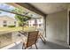 Relaxing screened-in patio with chairs overlooking a peaceful backyard area at 4917 Puritan Cir # 105, Tampa, FL 33617