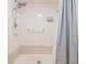 Standard bathroom shower with updated shower head and curtain at 4917 Puritan Cir # 105, Tampa, FL 33617