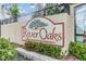 River Oaks sign, a private condominium community, surrounded by lush landscaping at 4917 Puritan Cir # 105, Tampa, FL 33617