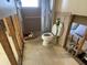 Bathroom with shower and toilet showing studs exposed ready for renovation at 5365 Dover Ne St, St Petersburg, FL 33703