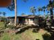 Exterior view showcasing a screened in lanai and mature trees at 5365 Dover Ne St, St Petersburg, FL 33703