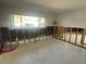 Bright living room featuring a large window and studs exposed ready for renovation at 5365 Dover Ne St, St Petersburg, FL 33703