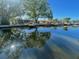 Scenic water view with lush trees reflecting off the calm water at 5365 Dover Ne St, St Petersburg, FL 33703