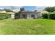 The well-maintained backyard features a screened lanai, providing an ideal outdoor space at 6116 Skylarkcrest Dr, Lithia, FL 33547