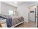 Comfortable bedroom featuring wood-look flooring, bright light and a closet for easy storage at 6116 Skylarkcrest Dr, Lithia, FL 33547