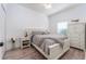 Cozy bedroom boasting wood-look flooring and a well-lit ambiance thanks to the sunny window at 6116 Skylarkcrest Dr, Lithia, FL 33547