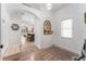 Welcoming entryway boasts neutral color palette, arched doorways, decor niche and durable flooring at 6116 Skylarkcrest Dr, Lithia, FL 33547
