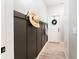 Inviting entryway with stylish decor and a practical coat rack, providing a welcoming first impression at 6116 Skylarkcrest Dr, Lithia, FL 33547