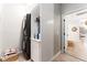 Efficient laundry area with sleek stacked washer and dryer units and functional storage, maximizing space at 6116 Skylarkcrest Dr, Lithia, FL 33547