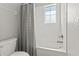 Modern bathroom featuring a tiled shower/tub combination with a shower curtain at 6731 Rocky Park St, Tampa, FL 33625