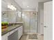 Stylish bathroom featuring a double sink vanity with granite countertop and glass shower at 6731 Rocky Park St, Tampa, FL 33625