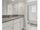 Bathroom with granite countertop and shower with tiled walls at 6731 Rocky Park St, Tampa, FL 33625