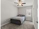 Inviting bedroom with a ceiling fan and natural light from the window at 6731 Rocky Park St, Tampa, FL 33625