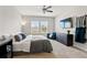 Comfortable bedroom with plush bed, ceiling fan, and flat screen TV at 6731 Rocky Park St, Tampa, FL 33625
