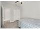 Cozy bedroom with carpeted floor, a ceiling fan and closet space at 6731 Rocky Park St, Tampa, FL 33625